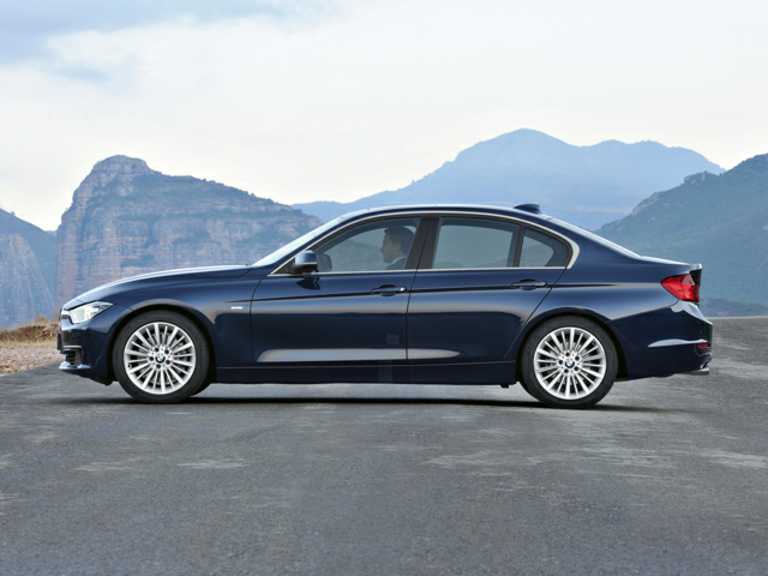 Blue 2014 BMW 3 Series From Driver Side