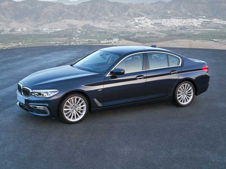 Blue 2020 BMW 5-Series With Mountains View