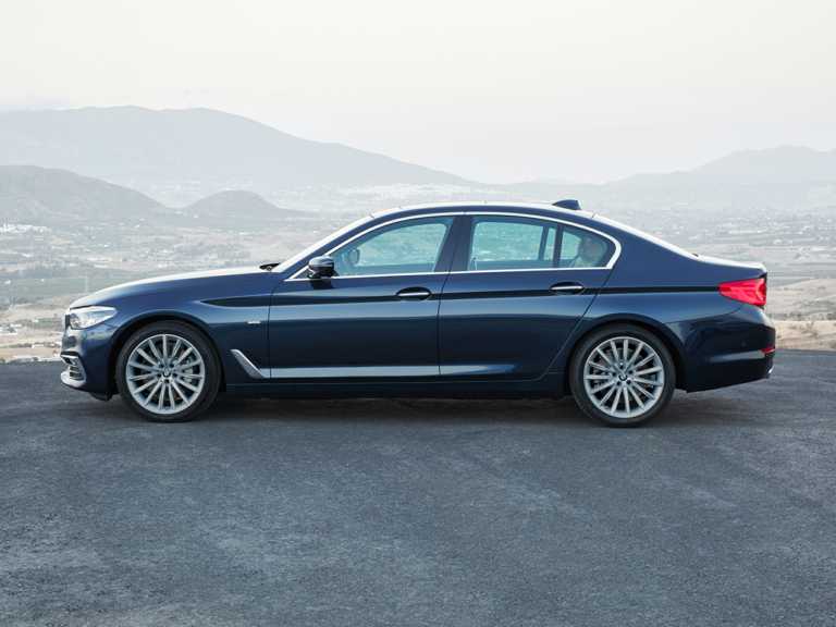 Blue 2020 BMW 5-Series From Driver Side