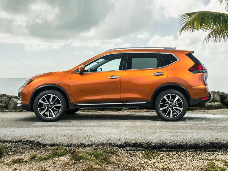 Orange 2018 Nissan Rogue From Driver Side