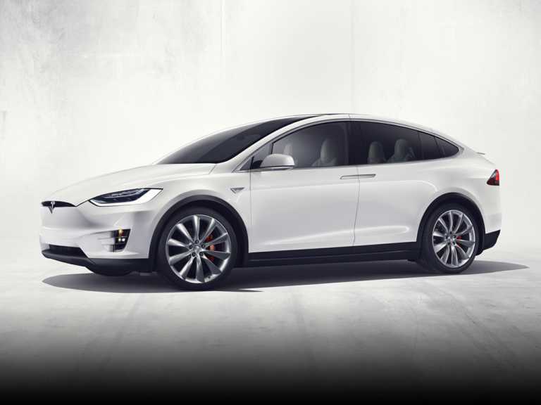 White Tesla Model X From Driver Side