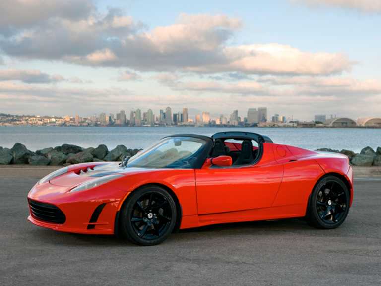 Red 2011 Tesla Roadster From Front-Driver Side