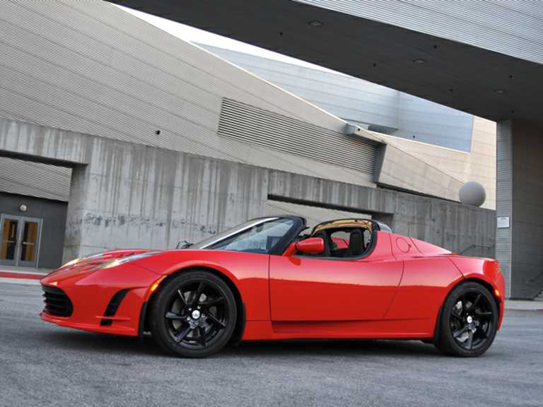 Red 2011 Tesla Roadster From Front-Driver Side