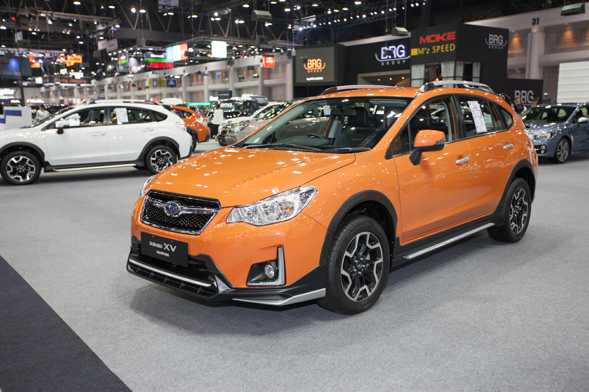Orange Subaru CrossTrek at auto show - Vehicle History