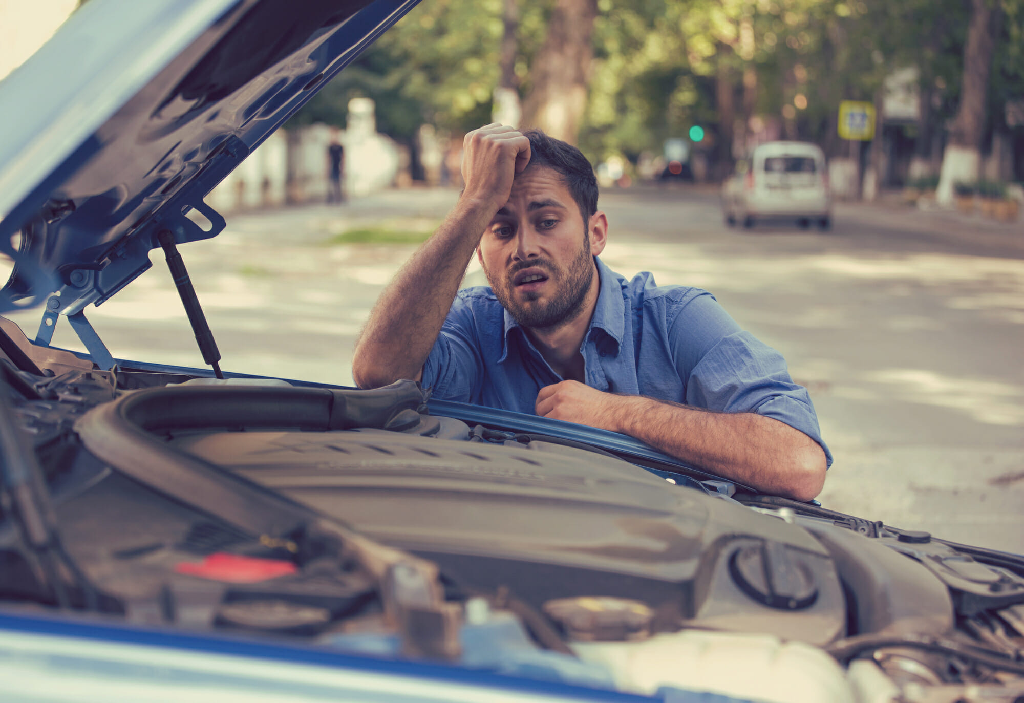 Man stressed by engine trouble - Photo by Deposit Photos