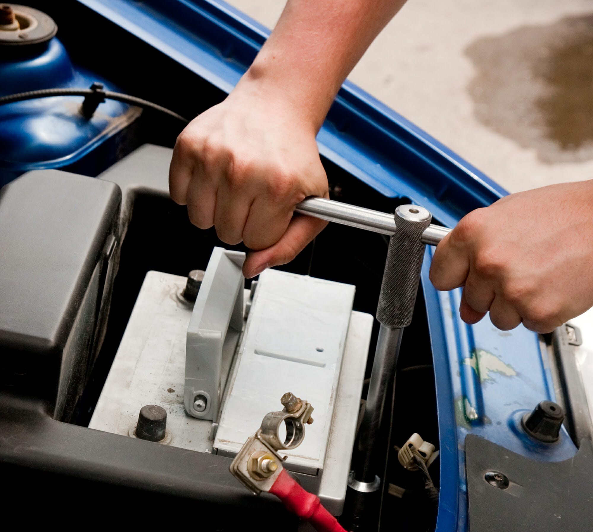 Auto Mechanic Changing A Car Battery