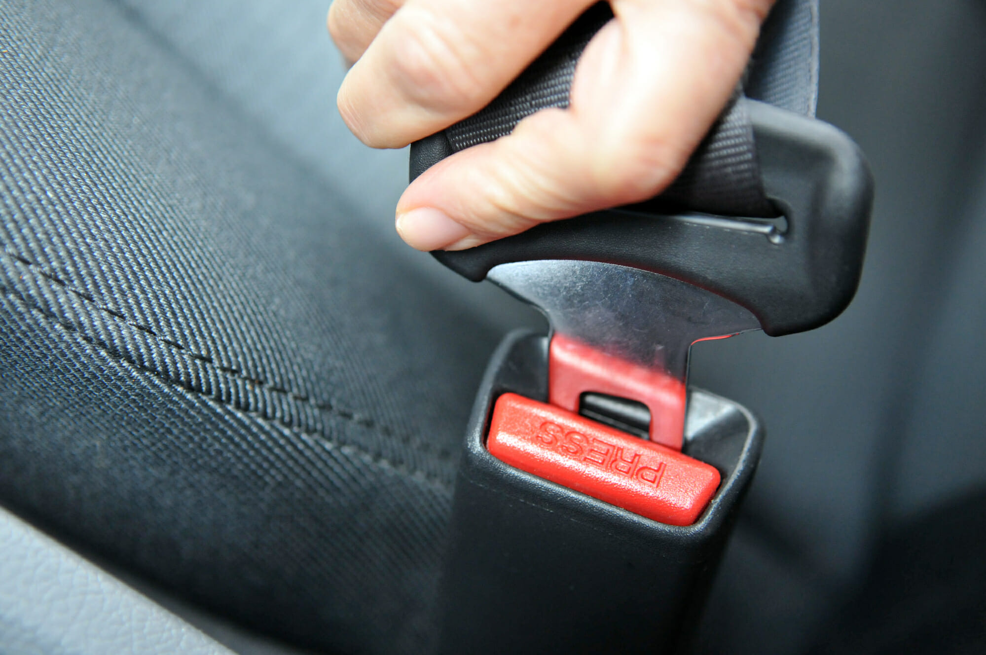 Driver Fastening A Seatbelt Closecup