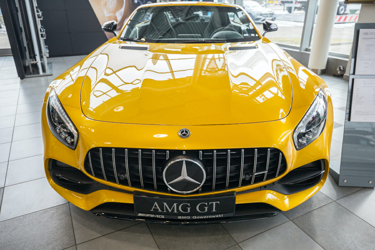 GDANSK, POLAND - FEBRUARY 13, 2018: Yellow Mercedes GT C Roadster in the car showroom of Gdansk, Poland. Mercedes GT C a 2-seater fastback roadster produced by Mercedes-AMG