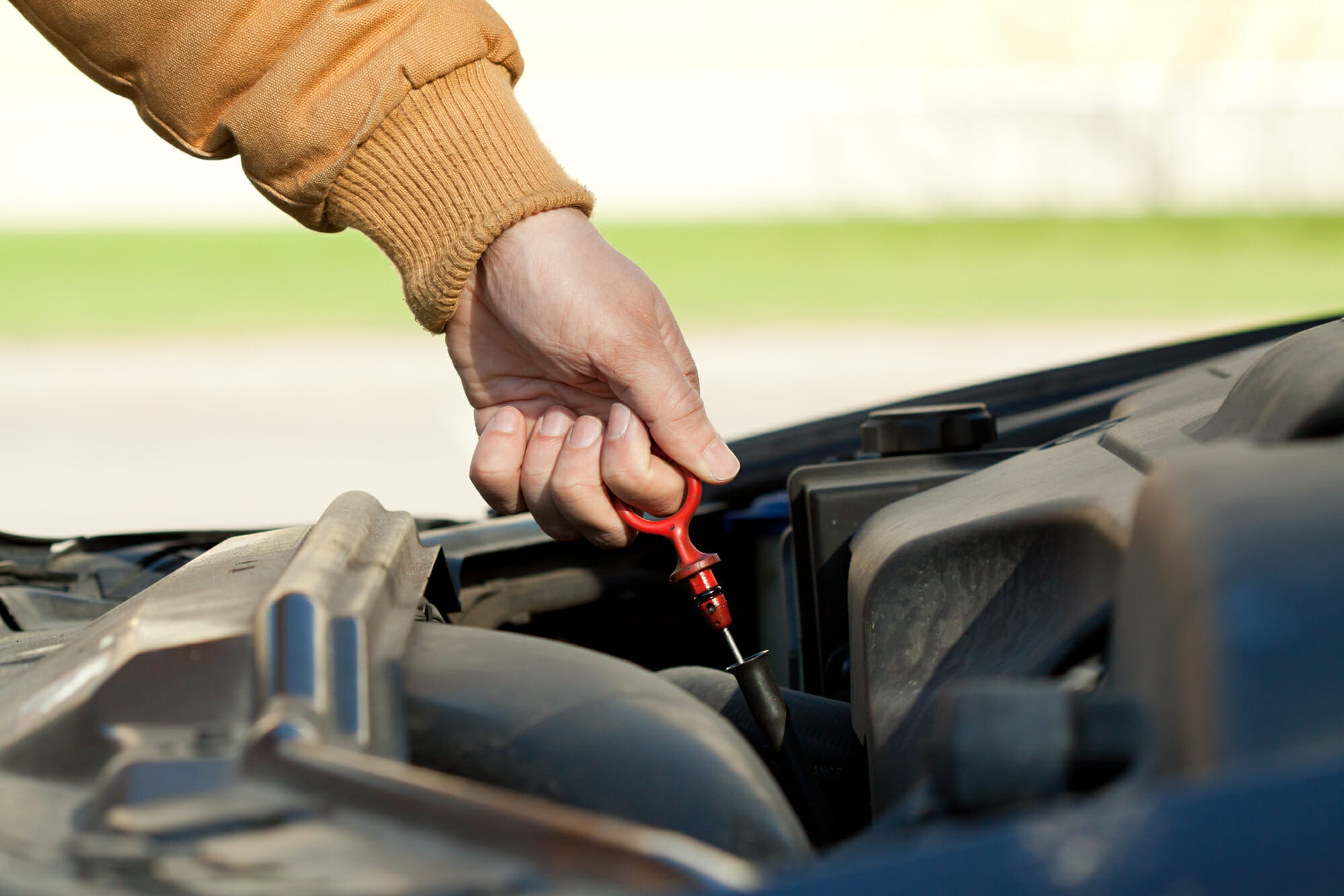 Mechanic Checking Car Oil Level