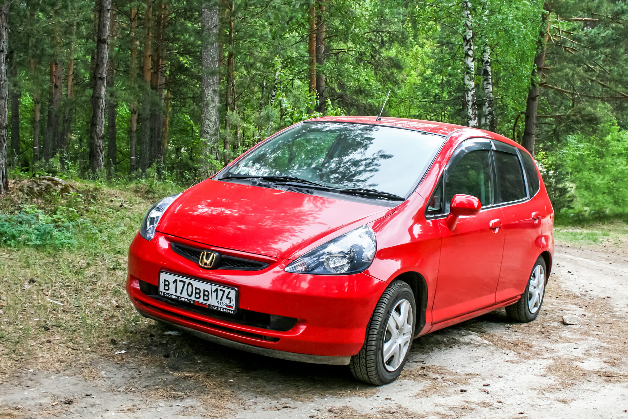 Red Honda Fit From Front-Driver Side