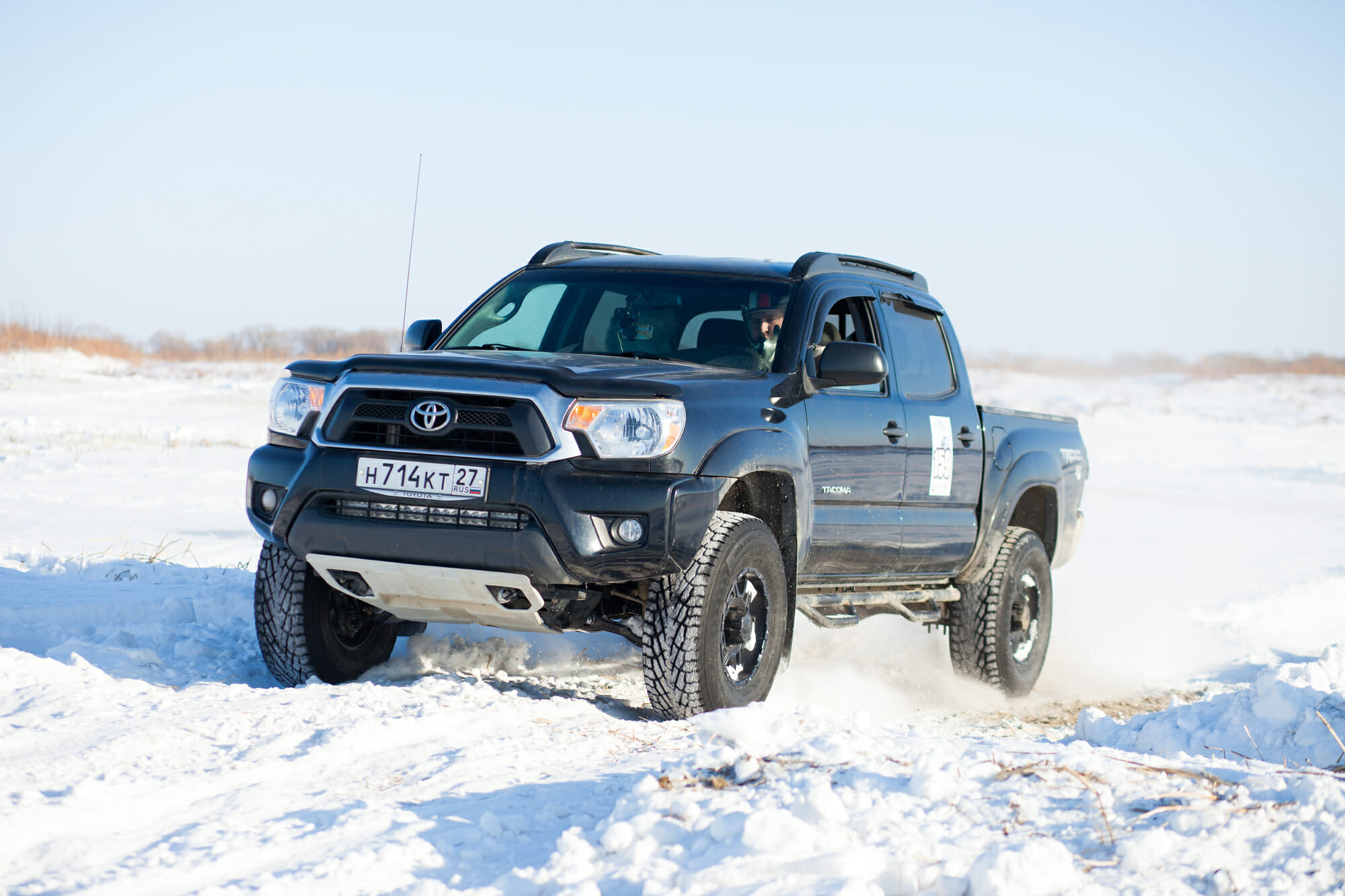 Black Toyota Tacoma In he Snow